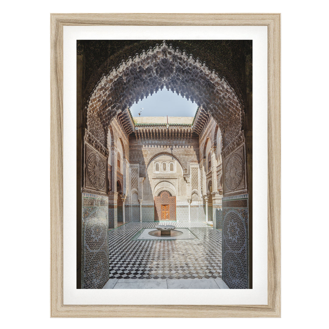 Ornate Madrasa Archway, Fes, Morocco fine art print in a natural wood frame with white mat