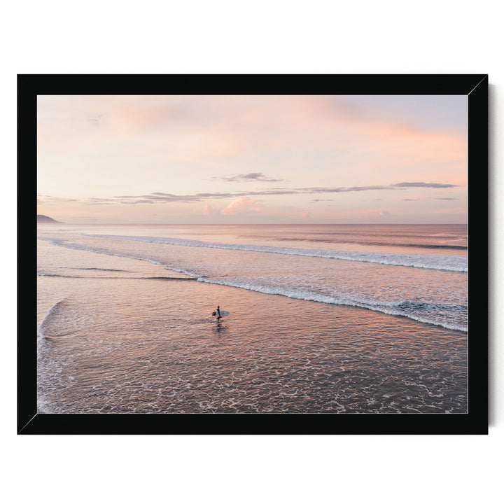Lone Surfer on a Pink Beach II, Costa Rica print in a black frame without mat