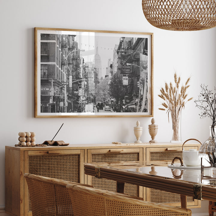 Little Italy and Empire State Building, New York City – B&amp;W framed print hanging in a styled interior