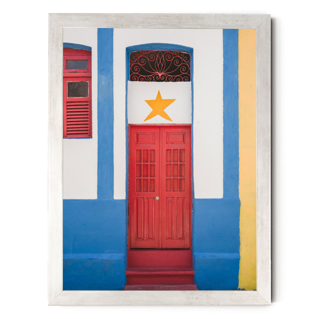 Red Door with Yellow Star, Olinda, Brazil print in a silver frame without mat