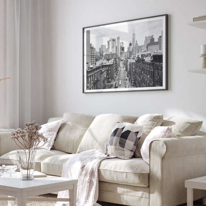 Lower Manhattan Street View, New York City – B&amp;W framed print in a living room setting