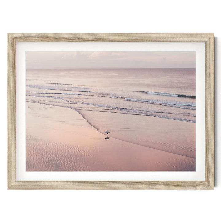 Lone Surfer on a Pink Beach I, Costa Rica fine art print in a natural wood frame with white mat