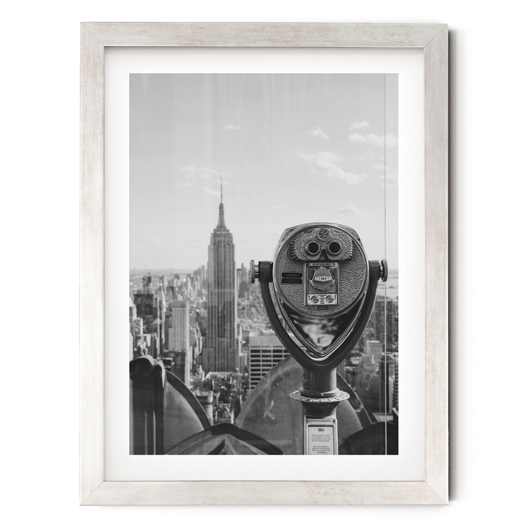 Binoculars and Empire State Building, New York City – B&amp;W print in a silver frame with white mat