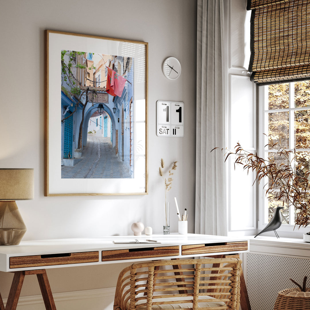 Moroccan Flag in the Blue City, Chefchaouen framed print hanging in a styled interior