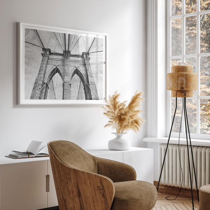 Brooklyn Bridge Tower, New York City – B&amp;W wall art displayed in a room setting