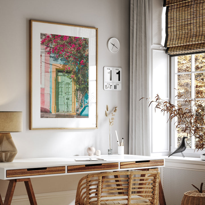 Bougainvillea and Green Door I, Olinda, Brazil framed print hanging in a styled interior