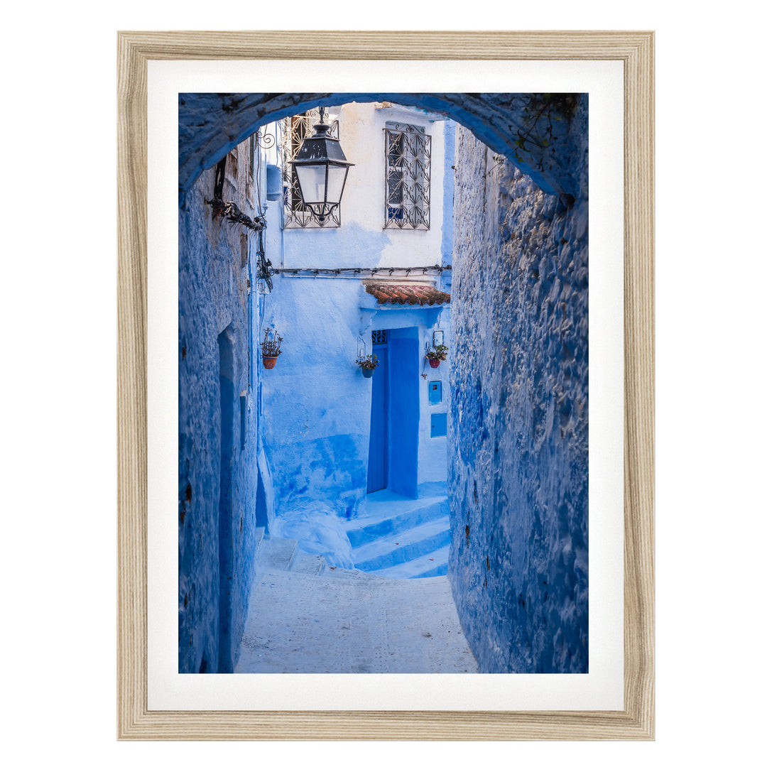 Blue Alley with Lantern, Chefchaouen, Morocco fine art print in a natural wood frame with white mat