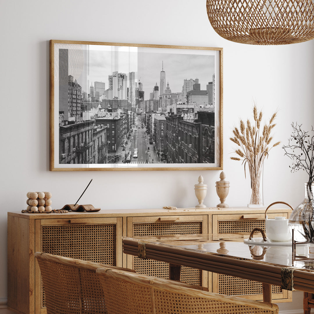 Lower Manhattan Street View, New York City – B&amp;W framed print hanging in a styled interior