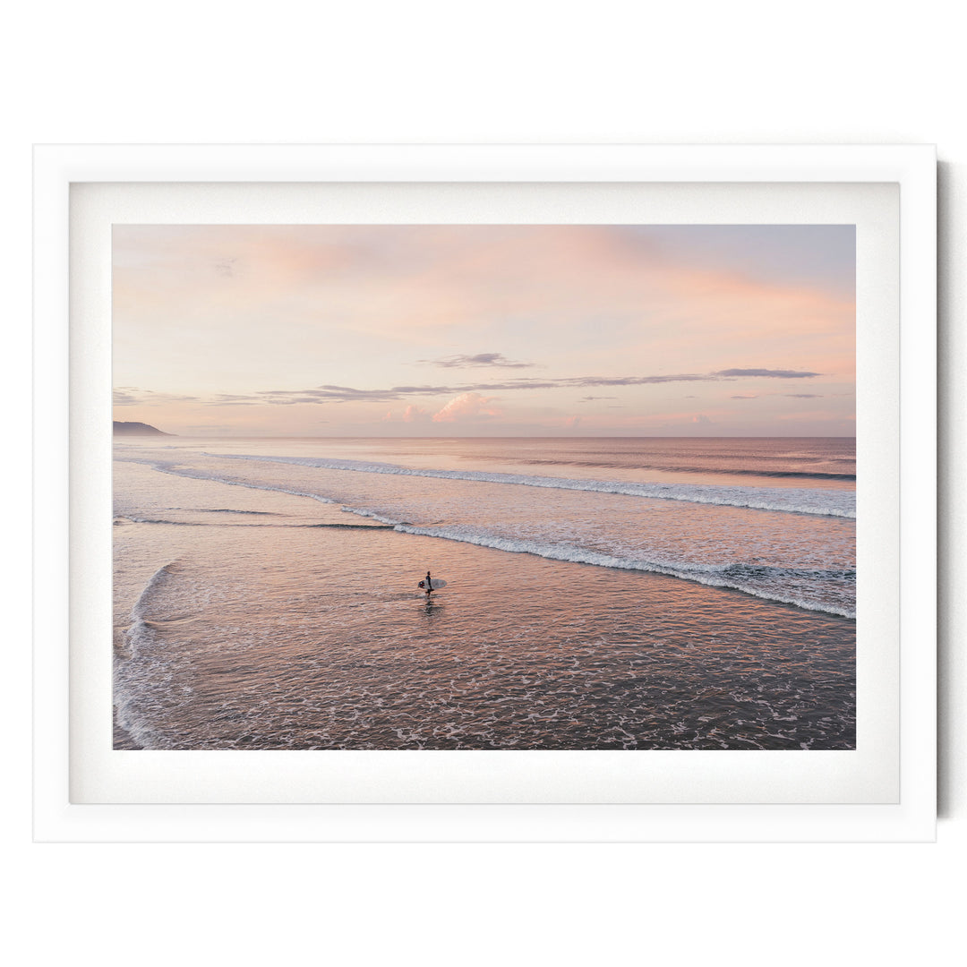 Lone Surfer on a Pink Beach II, Costa Rica print in a white frame with white mat
