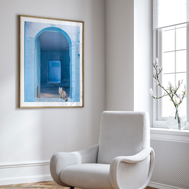Cat in the Blue Doorway, Chefchaouen, Morocco framed wall art in a cozy interior