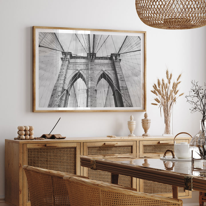 Brooklyn Bridge Tower, New York City – B&amp;W framed print hanging in a styled interior