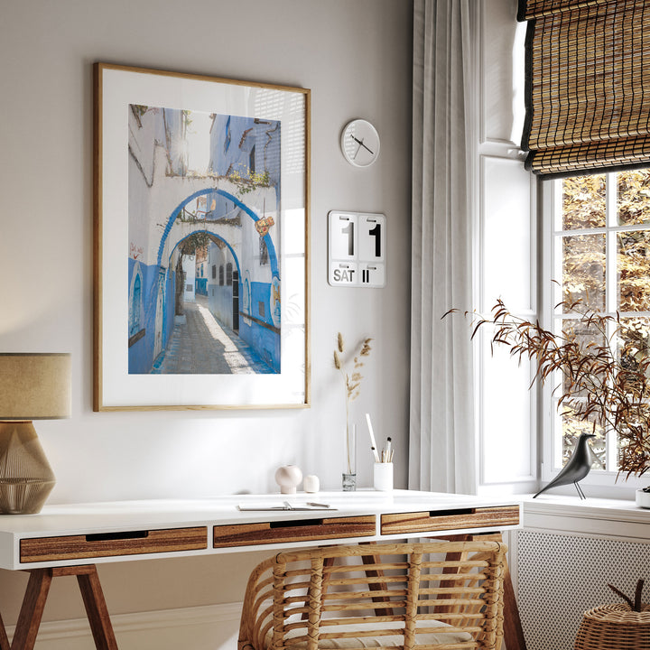 Blue Archways, Chefchaouen, Morocco framed print hanging in a styled interior
