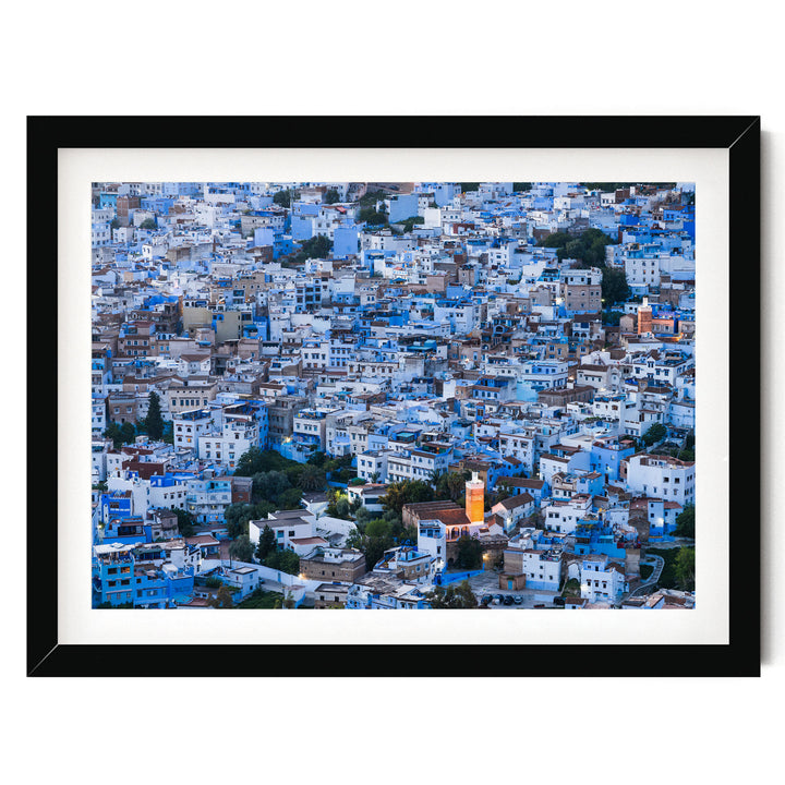 The image is a densely packed cityscape with numerous buildings in shades of blue and white, creating a visually striking and vibrant urban landscape.