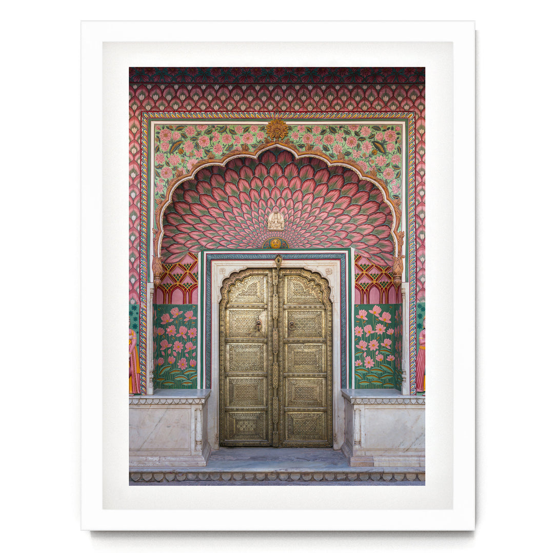 a large, ornate golden door with intricate designs and patterns, set within a colorful, decorative archway.