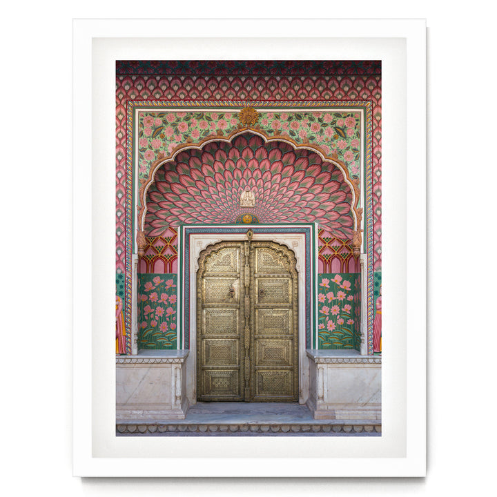 a large, ornate golden door with intricate designs and patterns, set within a colorful, decorative archway.