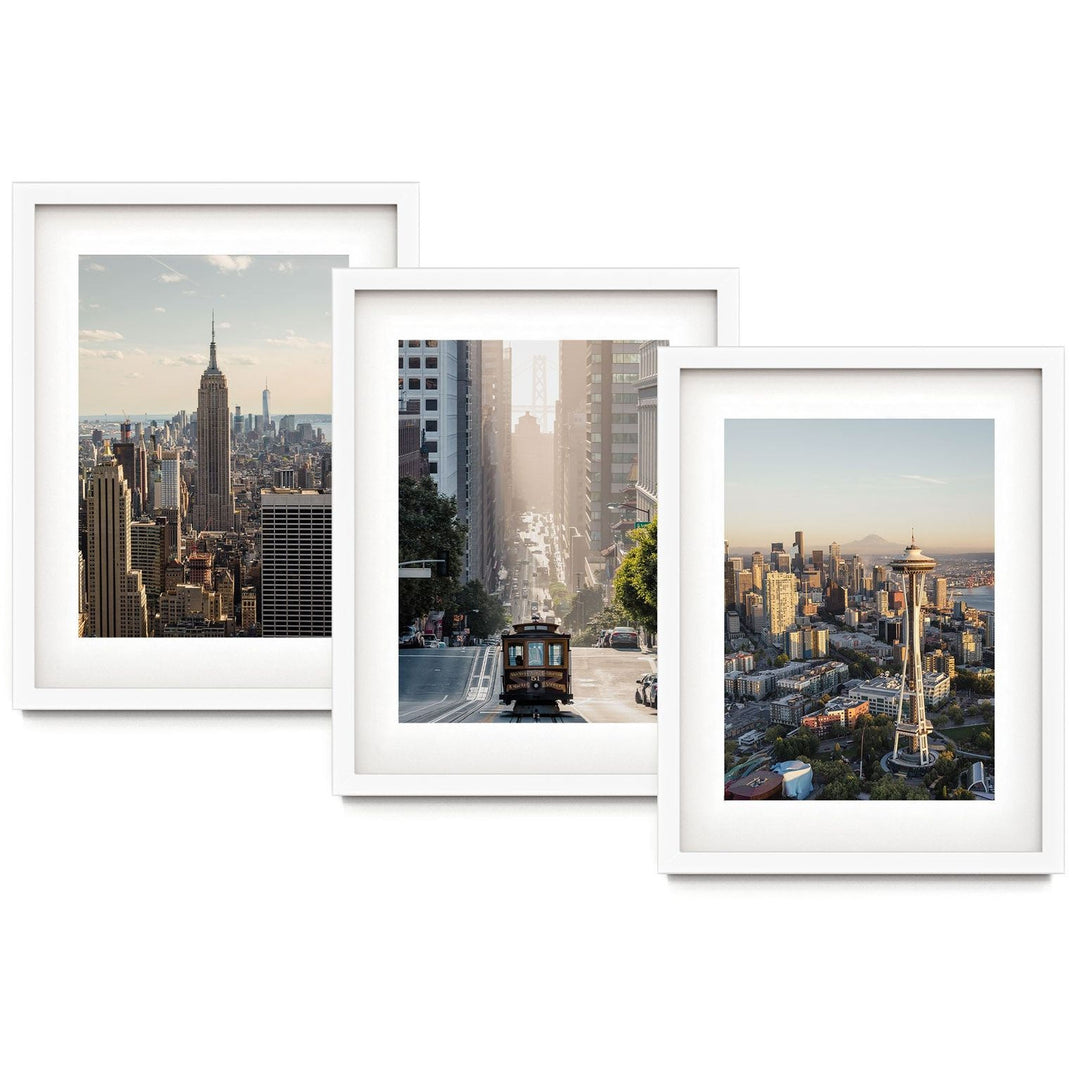 The image is a collage of three framed photographs depicting various cityscapes, including the iconic Empire State Building, the Space Needle, and a trolley car.