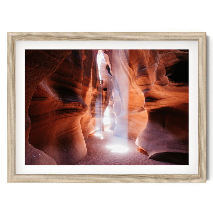 a narrow passage in a canyon, with sunlight streaming through the walls and creating a dramatic, ethereal atmosphere.