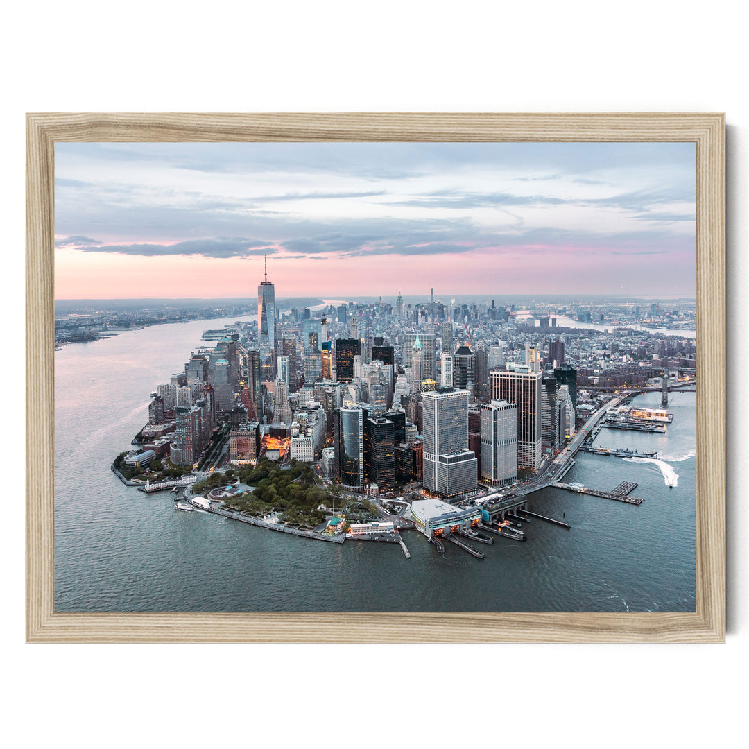 The image is an aerial view of the New York City skyline, showcasing the city's iconic skyscrapers and waterfront.