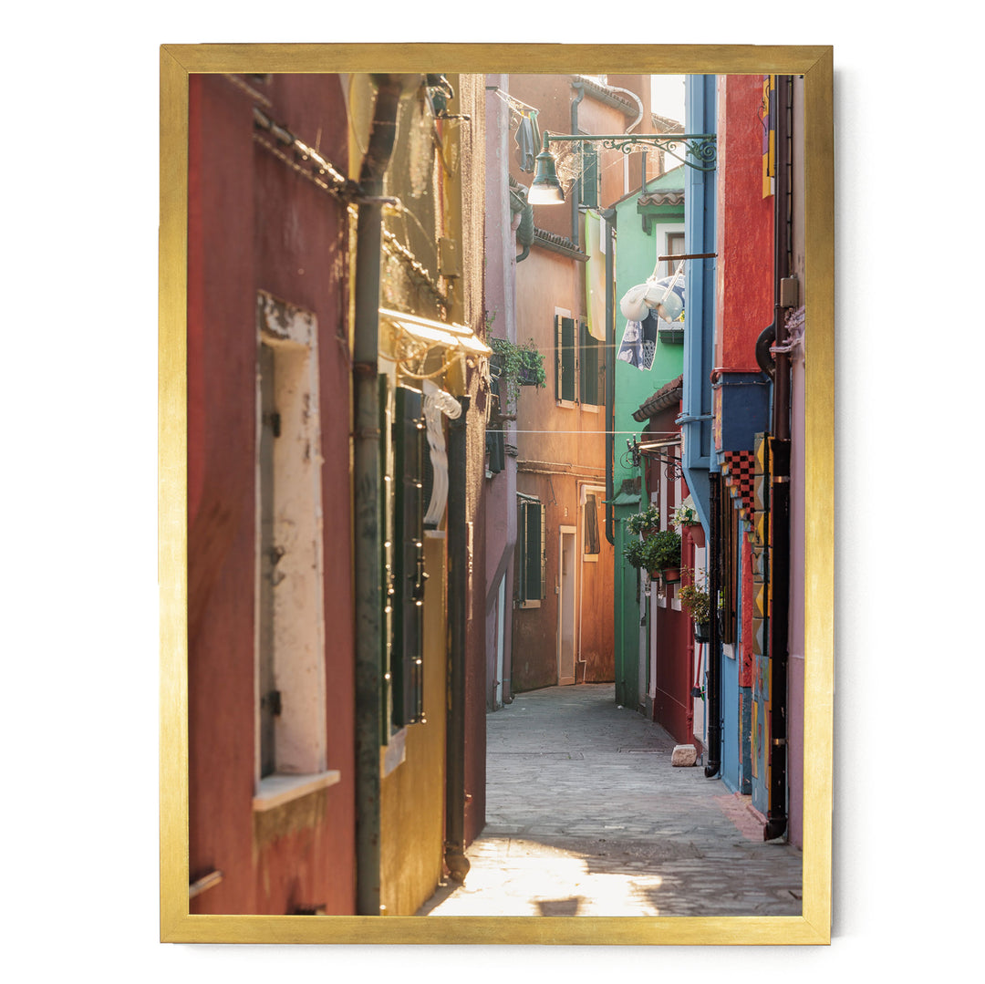 a narrow alleyway lined with colorful buildings, creating a vibrant and charming atmosphere.