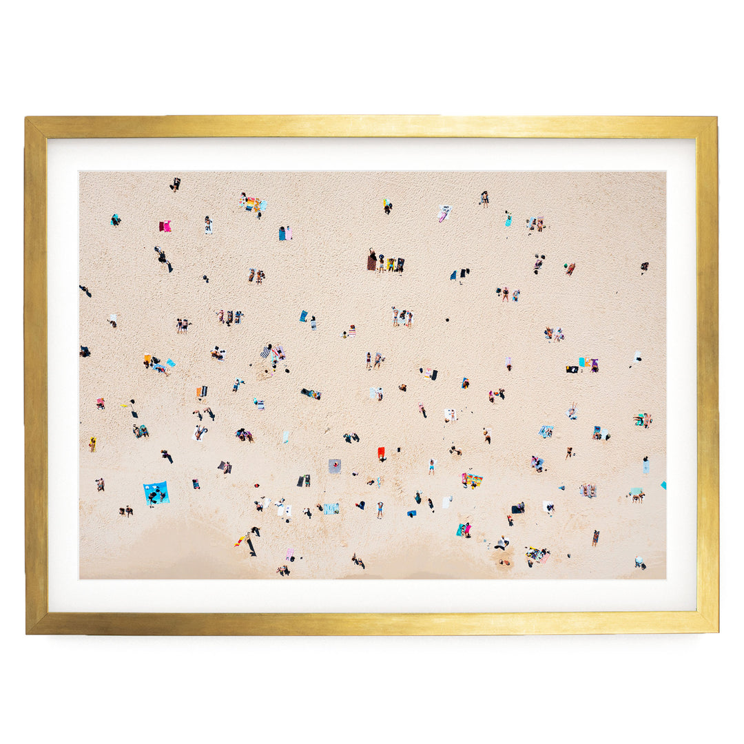 The image is a collage of multiple images depicting people on a beach, with a large number of individuals scattered across the sandy surface.
