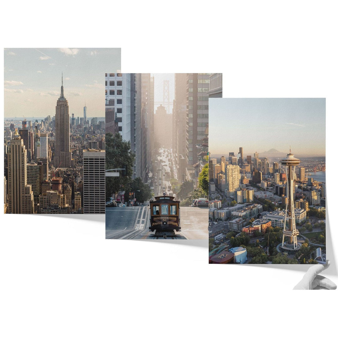 The image is a collage of three photographs depicting various scenes from the New York City skyline, including the Empire State Building, the Space Needle, and a trolley car.