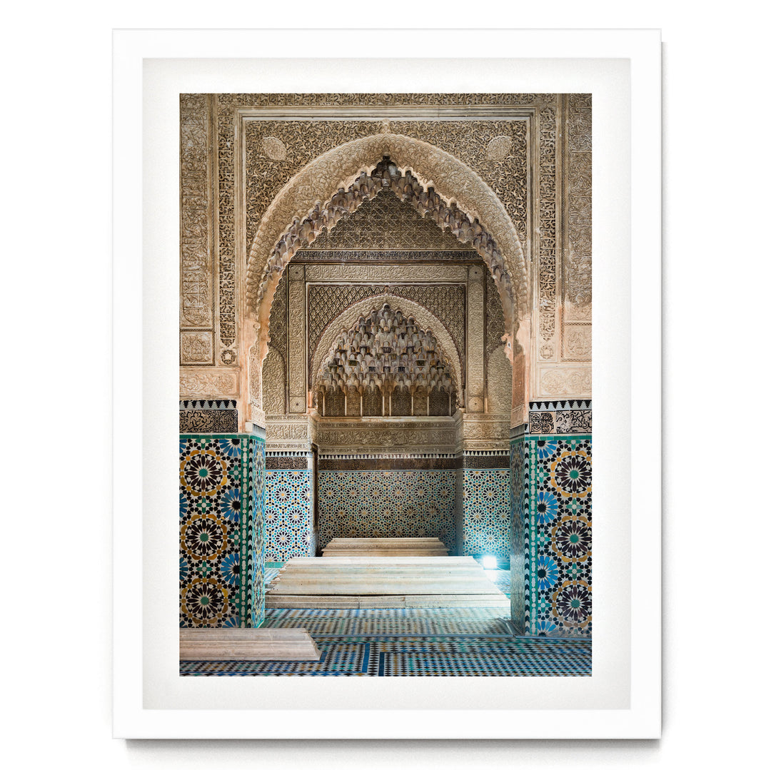 an ornate, intricately decorated interior space with a large archway, tiled walls, and a tiled floor.