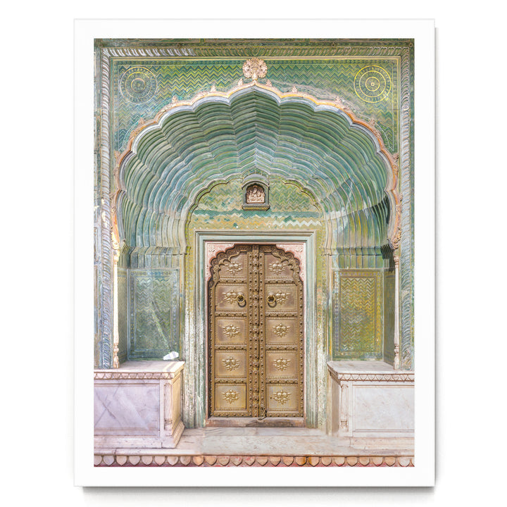 a large, ornate golden door with intricate carvings and patterns, set within an elaborate archway.