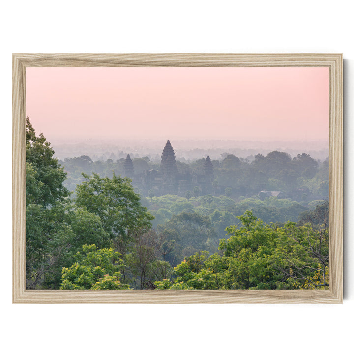 a serene landscape with a forested area and a temple in the distance, framed within a wooden border.