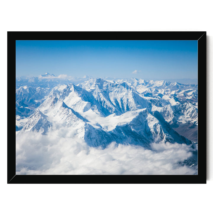 a breathtaking view of snow-capped mountains rising majestically from a vast expanse of clouds, creating a stunning natural landscape.