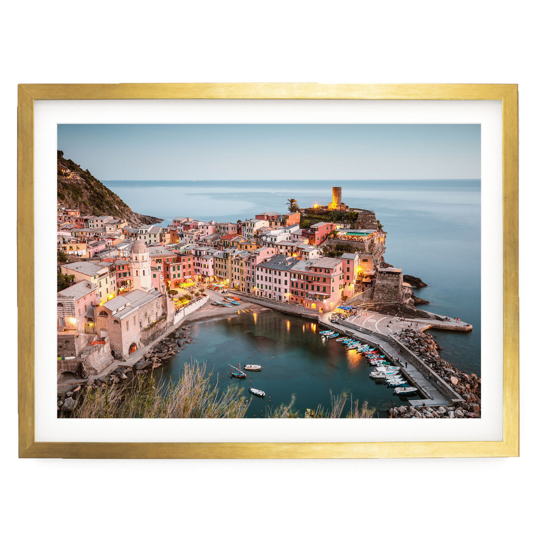 a picturesque coastal town with colorful buildings, a harbor filled with boats, and a lighthouse on a cliff overlooking the water.