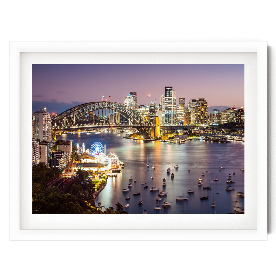 a vibrant cityscape at night, with a large bridge spanning a river and numerous boats dotting the water. The city skyline is illuminated by the lights of the buildings, creating a stunning and captivating scene.