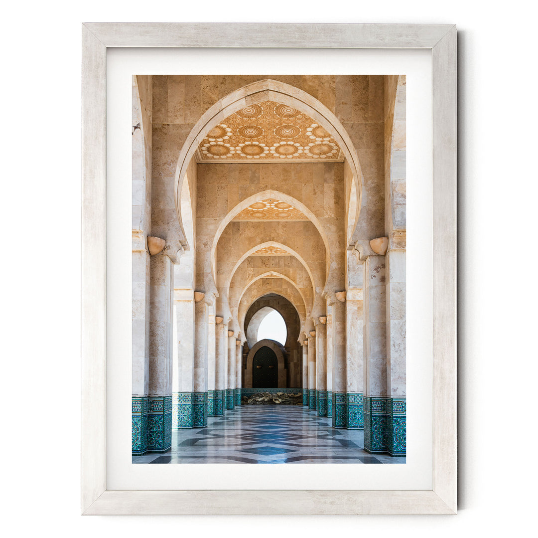 a long, ornate hallway with arched doorways and columns, creating a sense of depth and perspective.