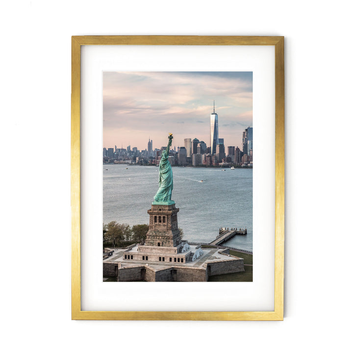 Statue of Liberty and New York Skyline II – fine art print in a gold frame with white mat