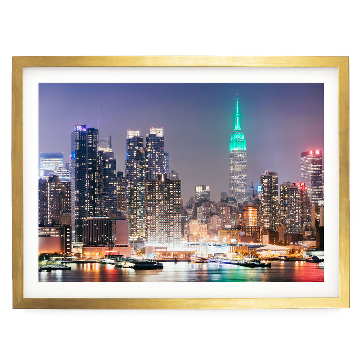 New York Skyline at Night – fine art print in a gold frame with white mat