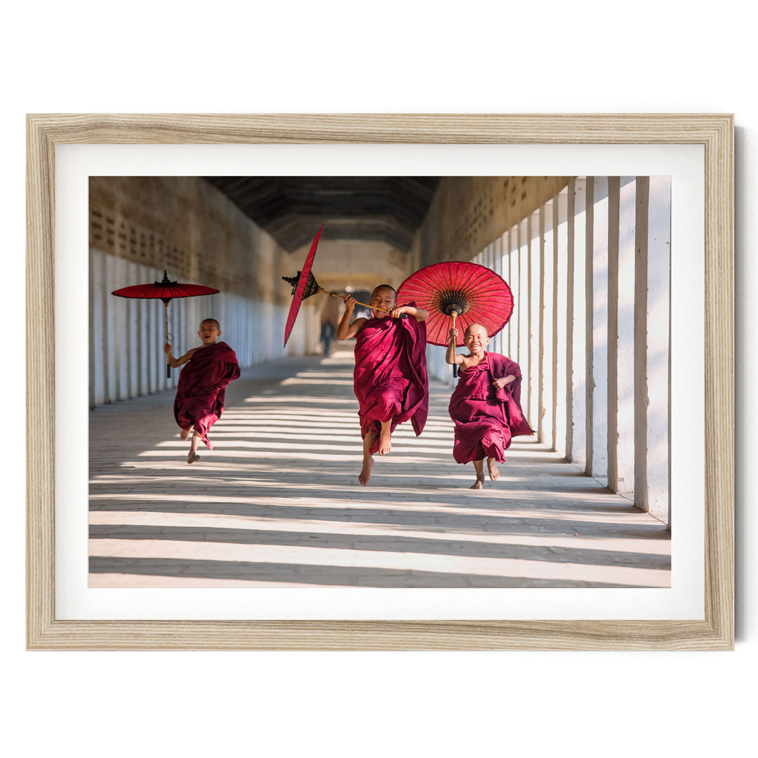 Joyful Monks II, Southeast Asia – fine art print in a natural frame with white mat