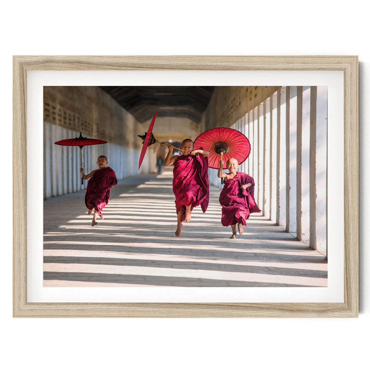 Joyful Monks II, Southeast Asia – fine art print in a natural frame with white mat