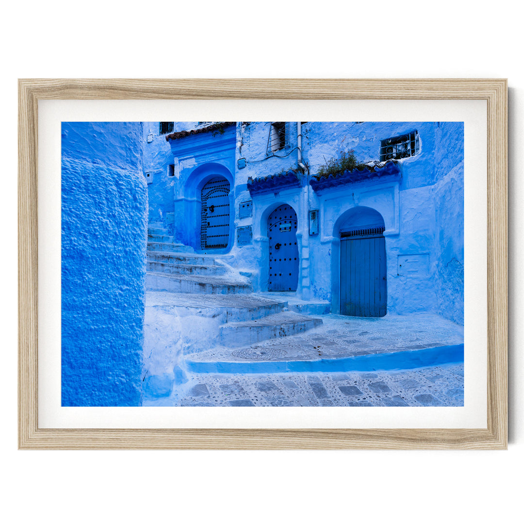 In the Streets of Chefchaouen, Morocco – fine art print in a natural frame with white mat