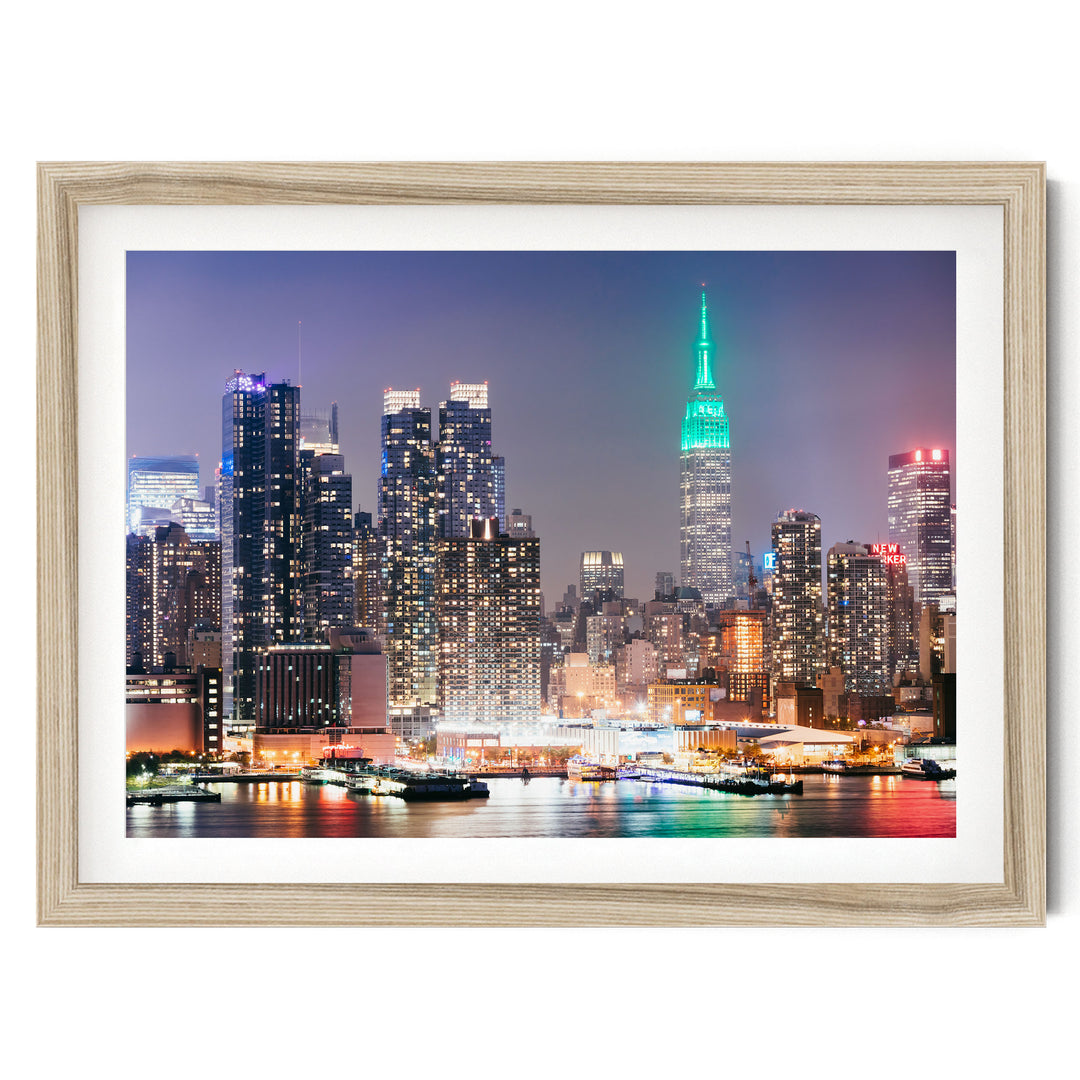 New York Skyline at Night – fine art print in a natural frame with white mat