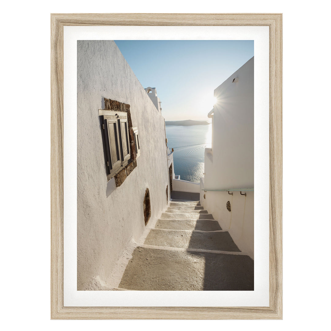 Walking in Oia, Santorini, Greece – fine art print in a natural frame with white mat