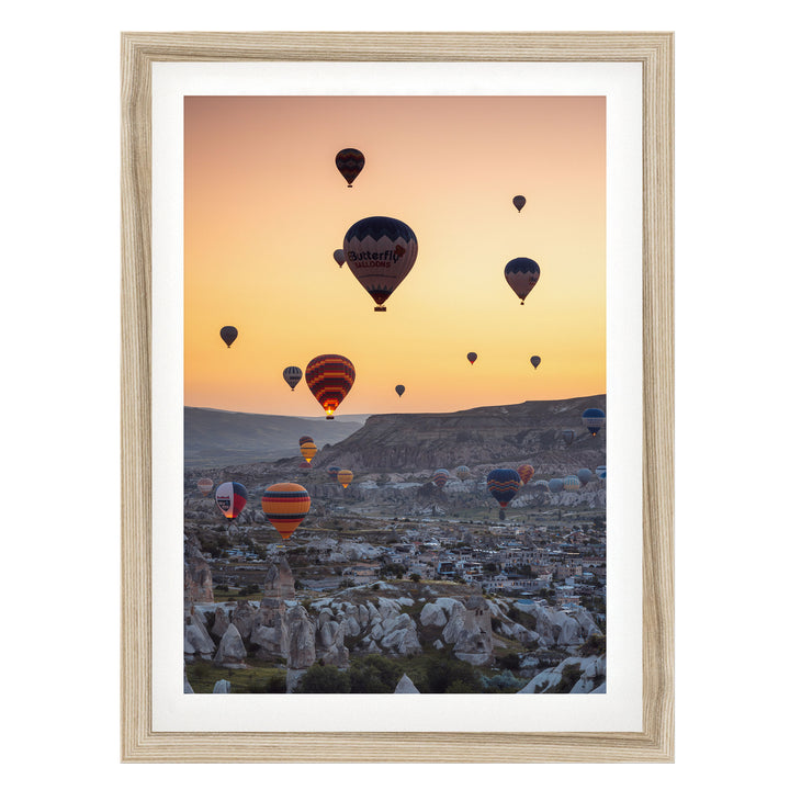 Hot Air Balloons over Cappadocia I, Turkey – fine art print in a natural frame with white mat