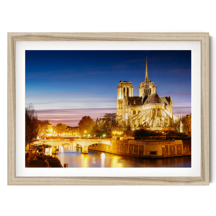 Notre-Dame at Night, Paris, France – fine art print in a natural frame with white mat
