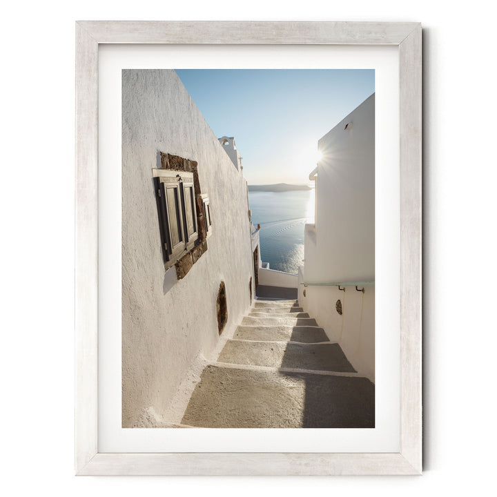 Walking in Oia, Santorini, Greece – fine art print in a silver frame with white mat