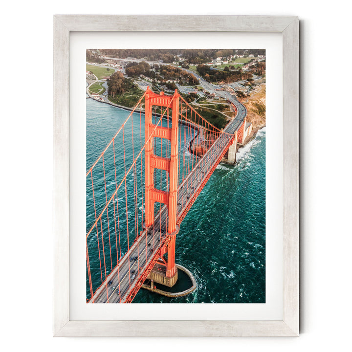 Flying over the Golden Gate Bridge I, San Francisco – fine art print in a silver frame with white mat