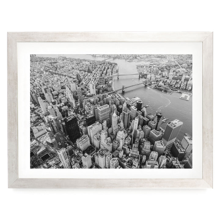 Flying over Manhattan, New York City – fine art print in a silver frame with white mat