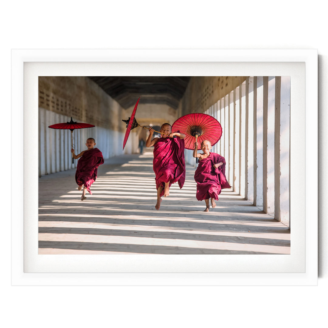 Joyful Monks II, Southeast Asia – fine art print in a white frame with white mat