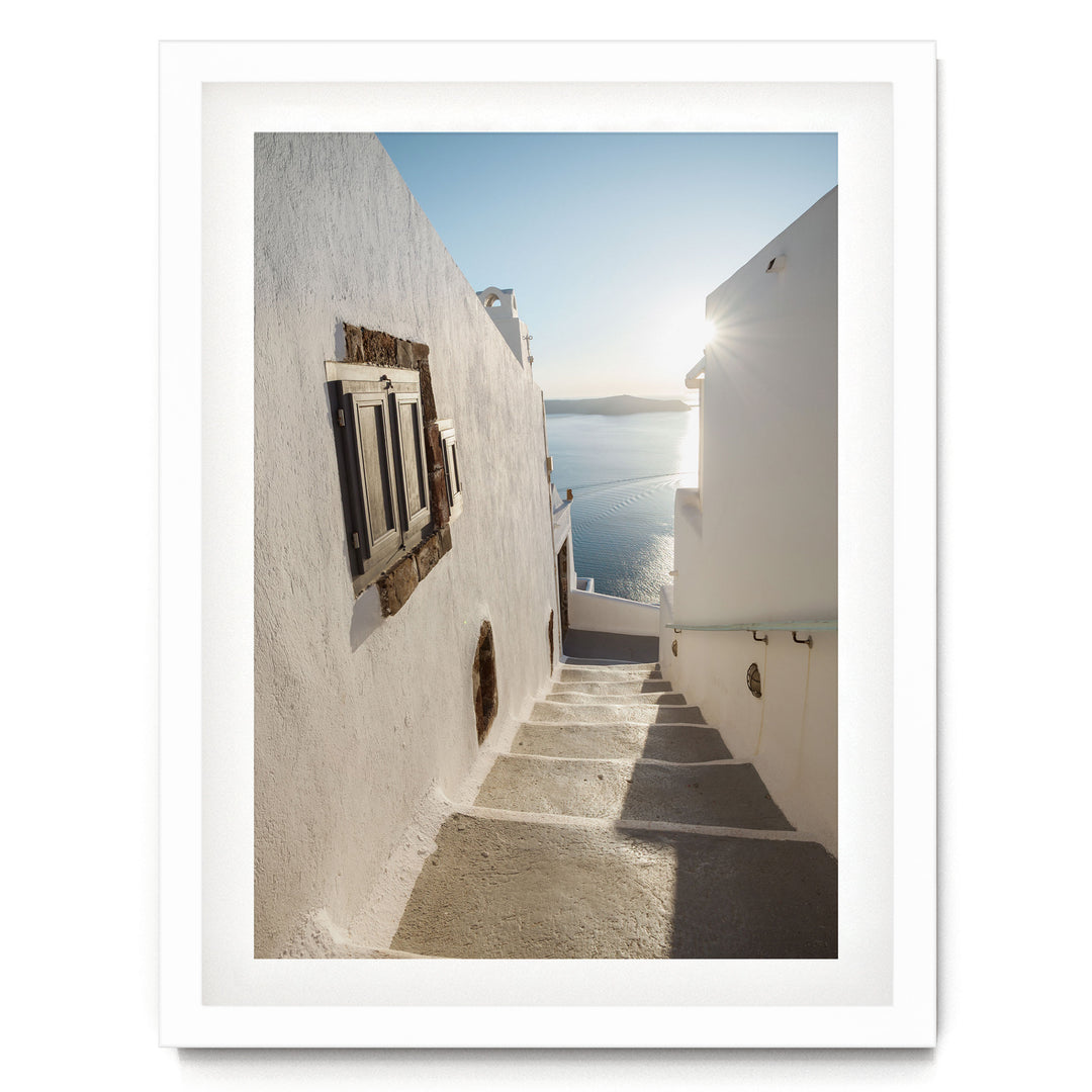 Walking in Oia, Santorini, Greece – fine art print in a white frame with white mat